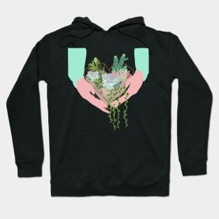 Hands holding heart shaped terrarium with succulents Hoodie